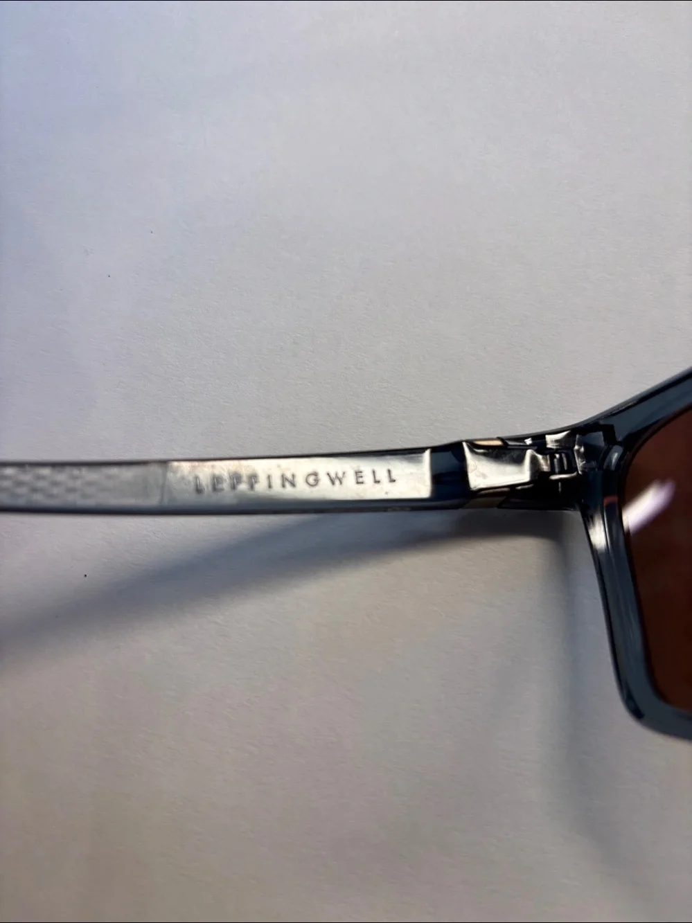 Oakley Sunglasses - Translucent Smoke Frame with Rose Mirror Lenses